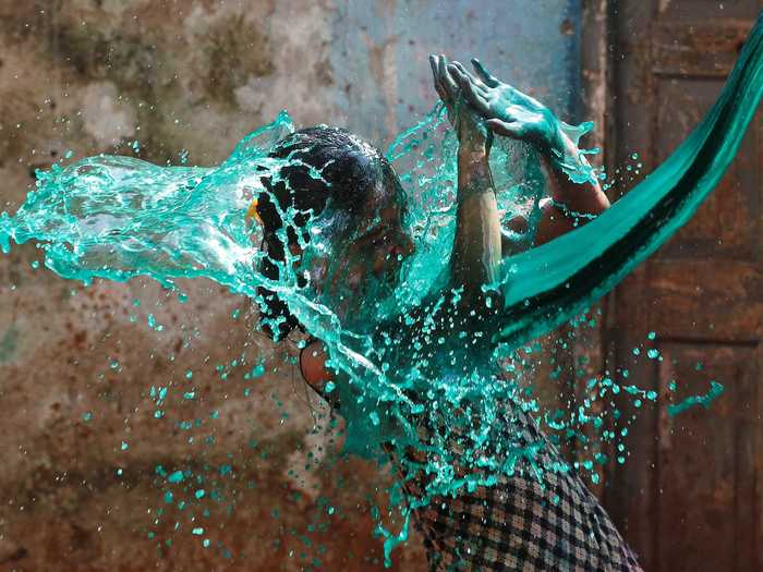 This photographer got the timing just right to capture celebrations of Holi, the Festival of Colors, in India.