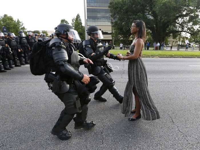 "A woman standing calmly, her long dress moving in the breeze, two police officers in full riot gear make their move," Reuters photographer Jonathan Bachman said of capturing this shot from a demonstration in Baton Rouge.