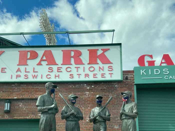 Statues of Ted Williams, Bobby Doerr, Johnny Pesky, and Dom DiMaggio outside of Fenway Park all wore masks.