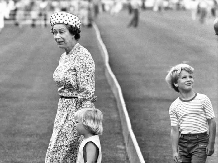 Queen Elizabeth II took Zara and Peter Phillips to see their mother, Princess Anne, ride horses in Windsor Great Park in 1984.