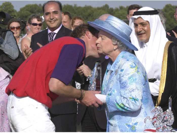 She plants kisses on them, as any grandmother would.