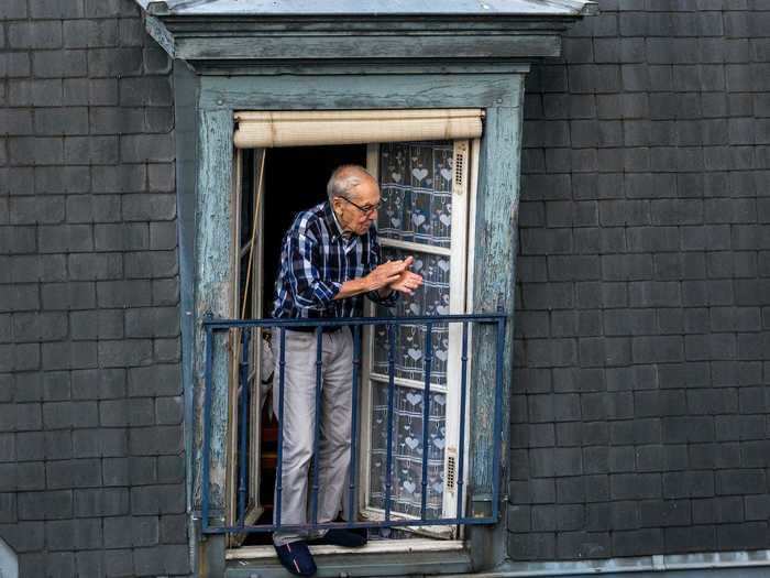 People across the world have also been taking time to thank healthcare workers from their homes. This man in Paris stepped out on his balcony to clap for hospital workers below him.