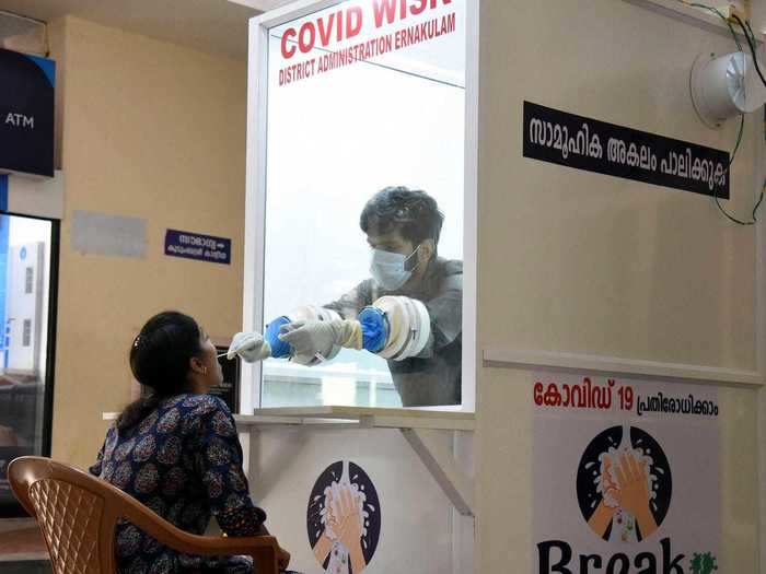 A similar design is being used in Kerala, India, where medics are testing people with two rubber gloves attached to a window of an airtight kiosk that looks like a phone booth.