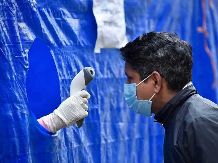 Meanwhile, other hospitals in the country are using only a plastic sheet as a barrier, with a hole cut in the middle for the medic