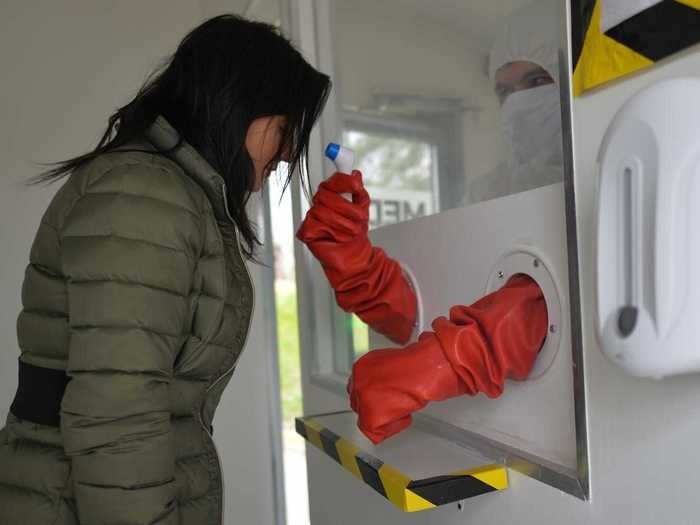 Some Polish cities, meanwhile, is using the kiosk/rubber glove design to check the temperatures of people entering hospitals or essential workplaces.