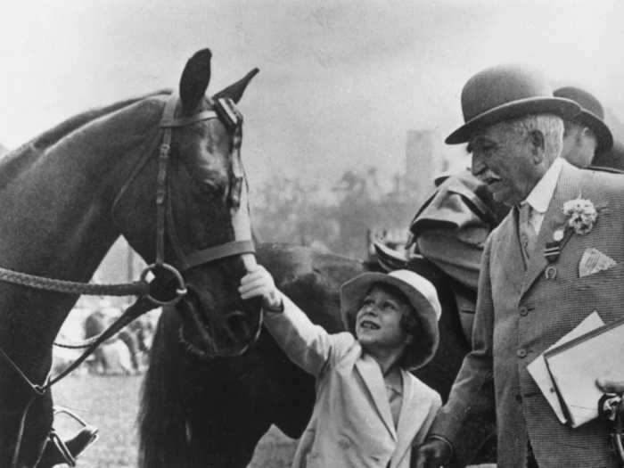 1934: The royals have always been keen equestrians. This photo shows Princess Elizabeth at Olympia