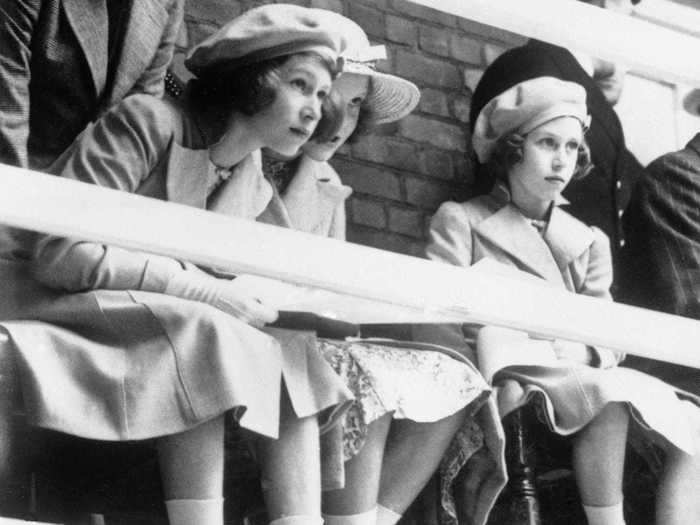 1939: Elizabeth and Princess Margaret, both keen swimmers, went to watch a swimming display given before the royal visitors at Dartmouth Naval College, on July 22, 1939.