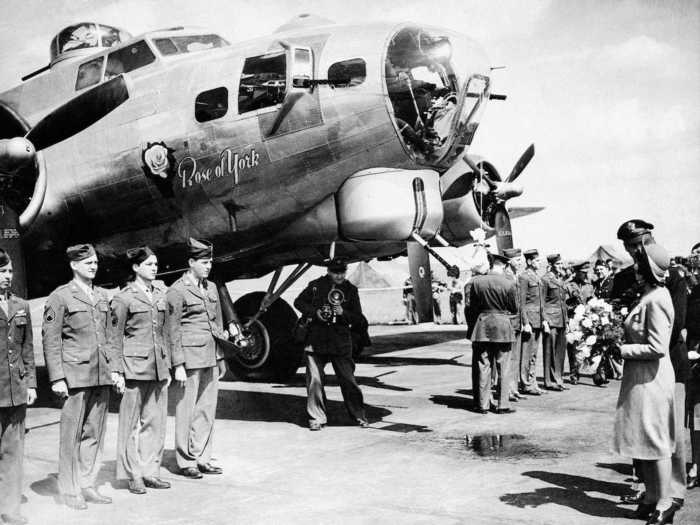 1944: Though the young royals were moved to Windsor castle for their safety during the war, Princess Elizabeth regularly greeted the troops before they began bombing raids. She christened the plane in this photo the "Rose of York."