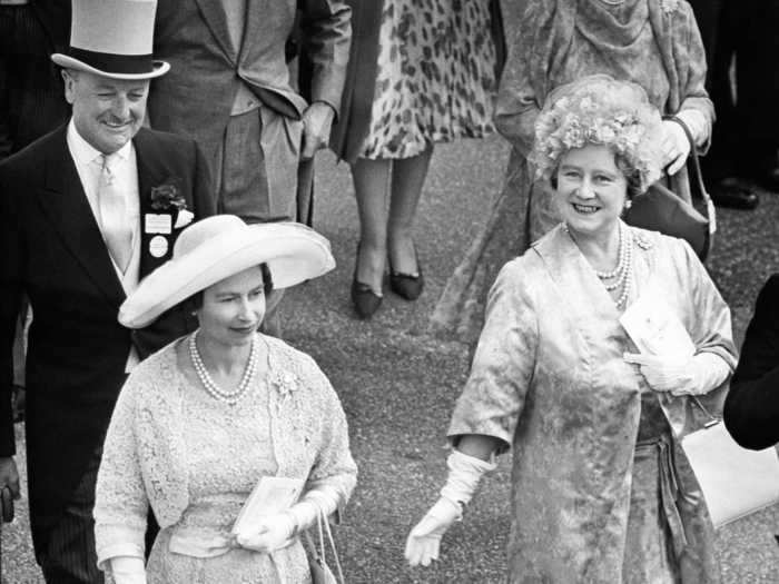 1962: The royals have always been avid racegoers. In 1962, the Queen attended the Ascot races with her mother. Elizabeth wore a blue lace​ dress to Ladies Day while her mother opted for a floral print.