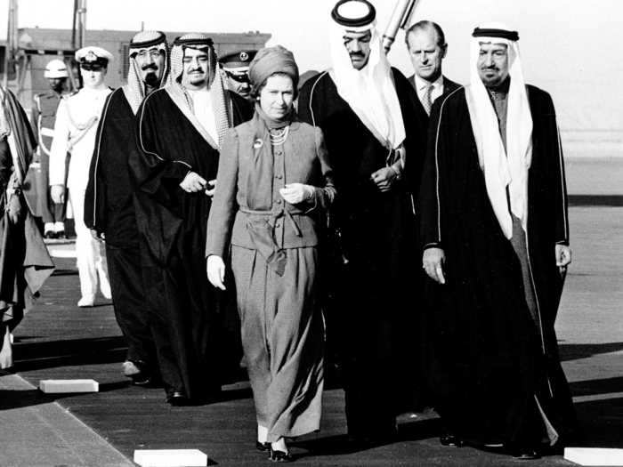 1979: The monarch has been a regular guest of Middle Eastern leaders throughout her reign. Here, she is escorted by King Khali of Saudi Arabia, far right, after her arrival at Riyadh Airport, Saudi Arabia. This was one of just eight official state visits to various countries made that year.