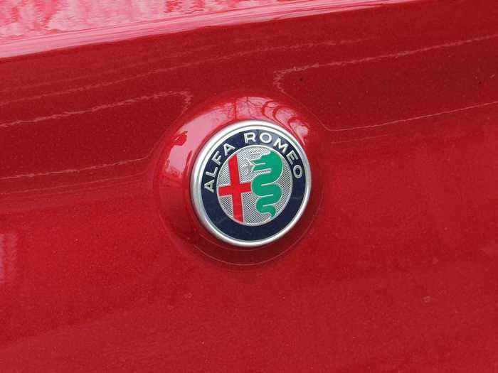 ALFA is an acronym for "Anonima Lombarda Fabbrica Automobili," the full name of the original company, dating to the early 1900s. The cross-and-serpent logo is unmistakable (and somewhat inexplicable).