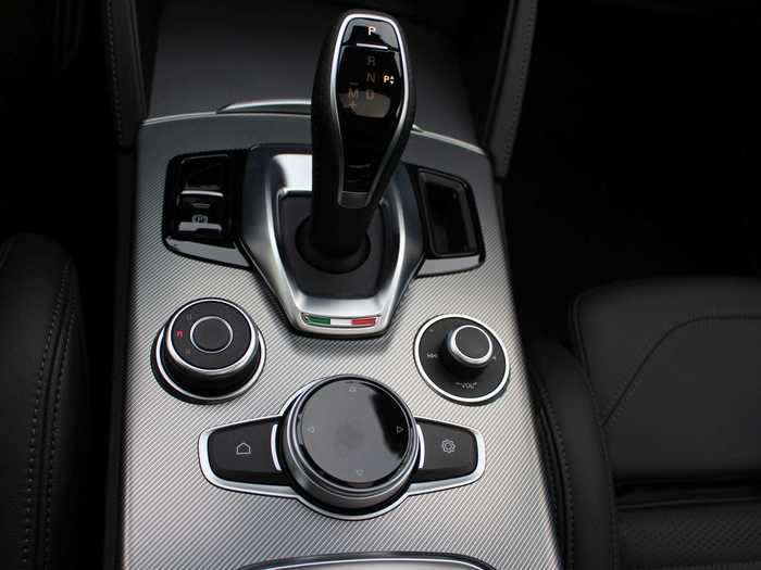 Infotainment can be operated using the control center below the shifter ...