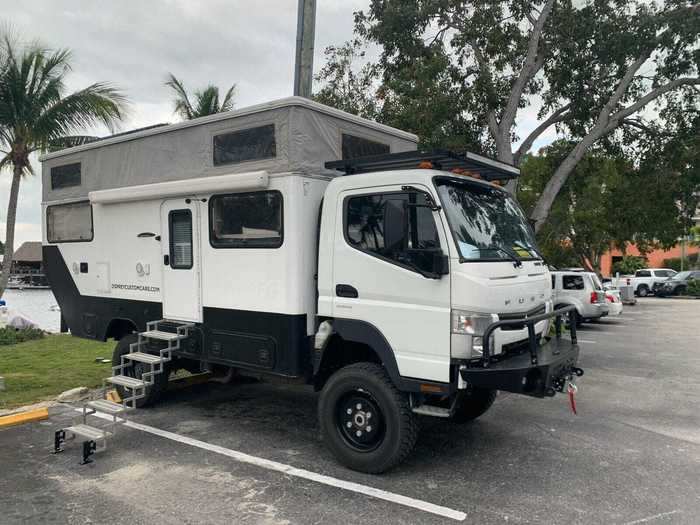 Thanks to an electric, pop-top roof, the camper can expand when people are enjoying the inside of the cabin.