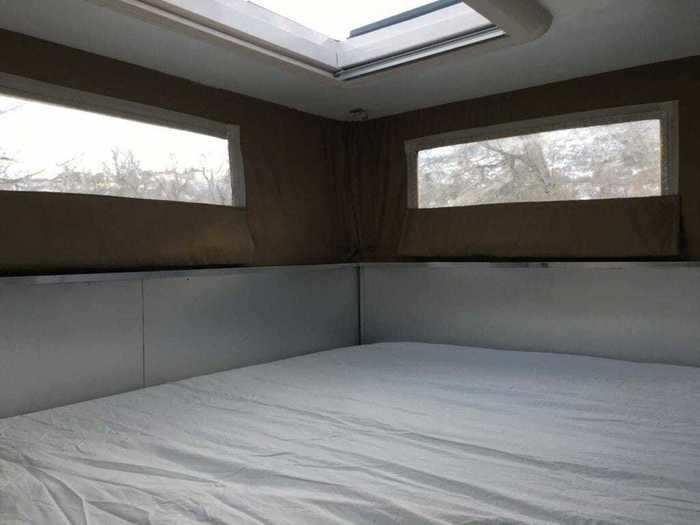 The bed lifts up to reveal a storage area underneath.