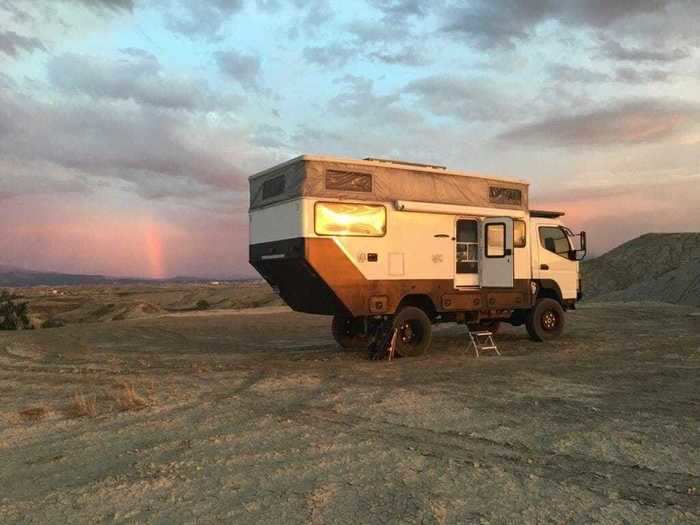 Two large solar panels provide power to the camper