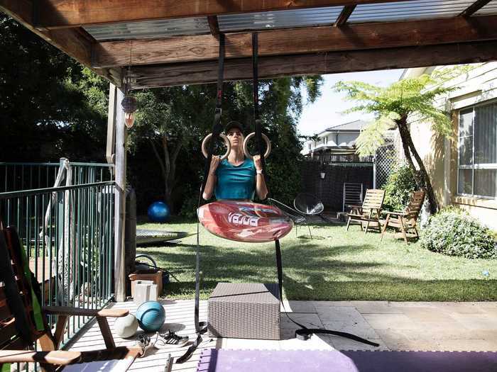 She worked out outside of the pool, too. Here, she held herself up along with the canoe.