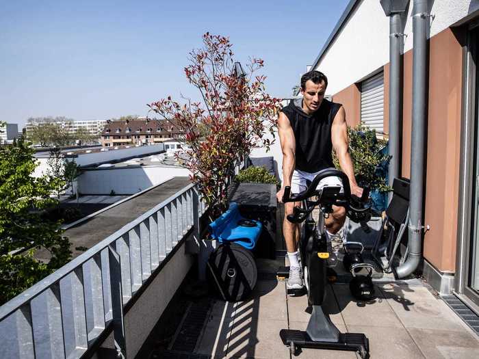 In Germany, hockey player Timur Oruz trained on a bicycle on his balcony in Cologne on April 17.