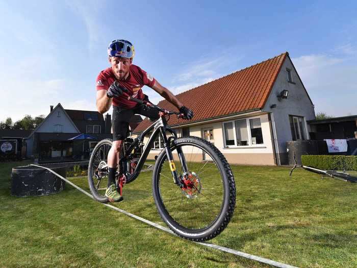 In Belgium, the bike training was a little more intense for mountain bike world champion Kenny Belaey who rode across a rope in his garden on April 16.