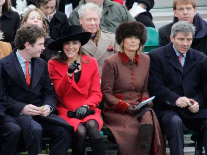 2006: In December 2006, Kate was pictured with her parents watching William take part in The Sovereign