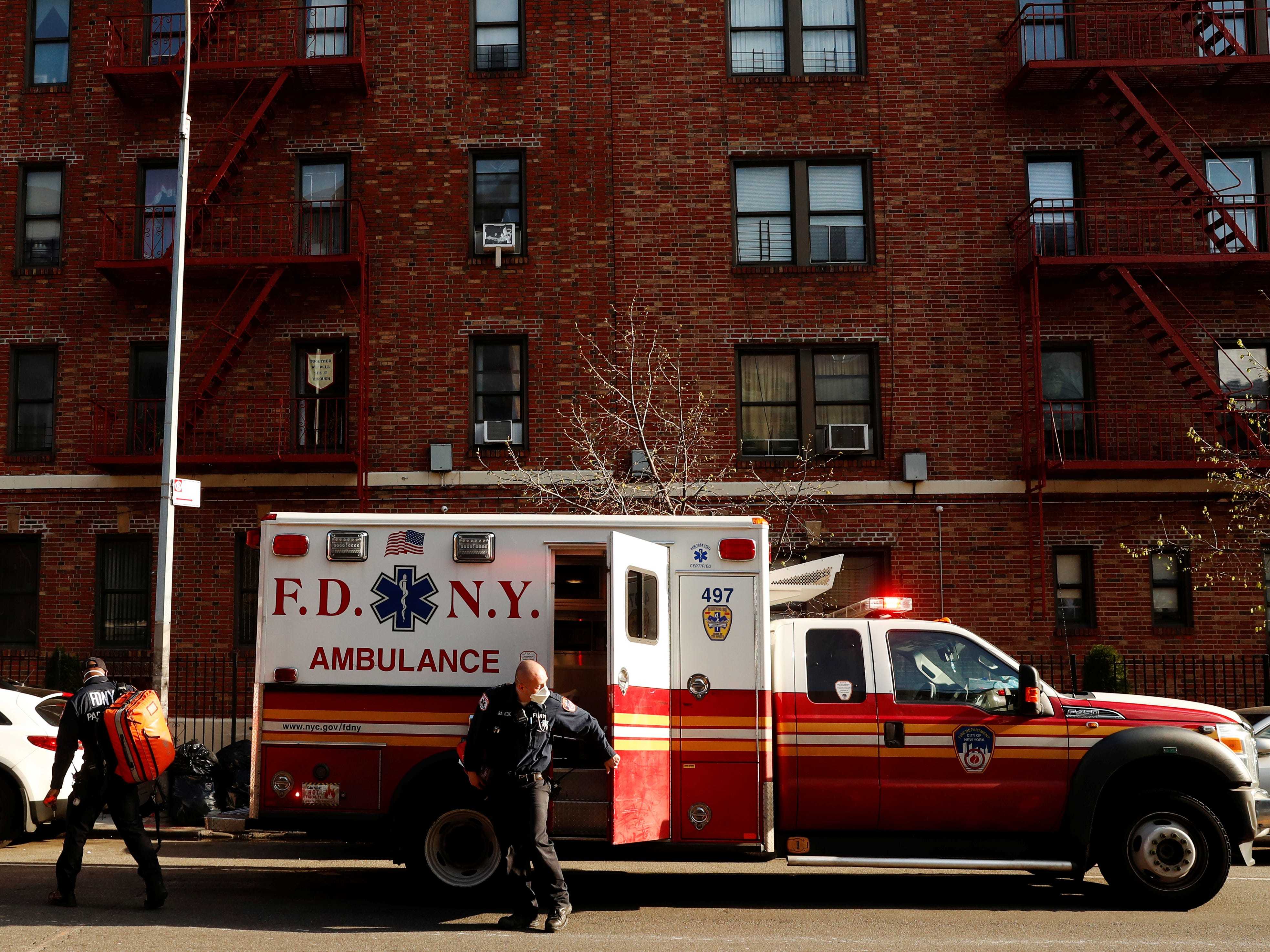FIEL PHOTO: New York City Fire Department (FDNY) Emergency Medical Technicians (EMT) wearing personal protective equipment arrive to assist a woman who was having difficulty breathing during ongoing outbreak of the coronavirus disease (COVID19) in New York, U.S., April 15, 2020. REUTERS/Lucas Jackson