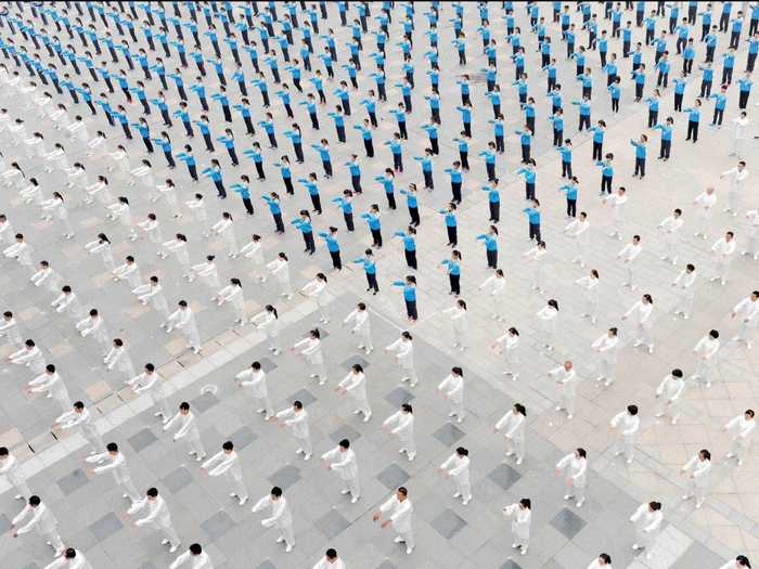 Aerial photos can capture the beauty of humans as well, like this group of people practicing tai chi.