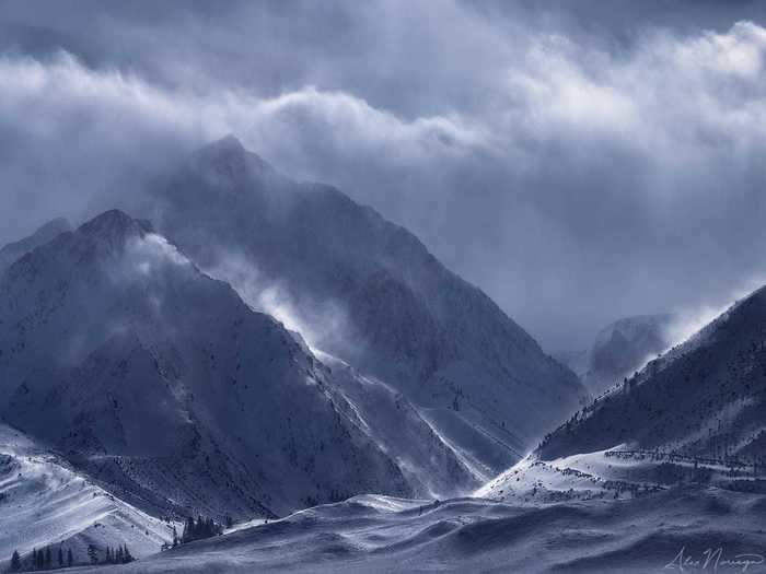 Up close, the Sierra Nevadas seem to be engulfed in a sea of fog and clouds.