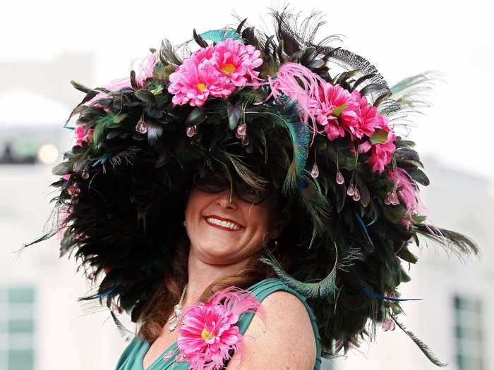 Pink flowers and a dense pile of peacock feathers adorned this 2012 headpiece.