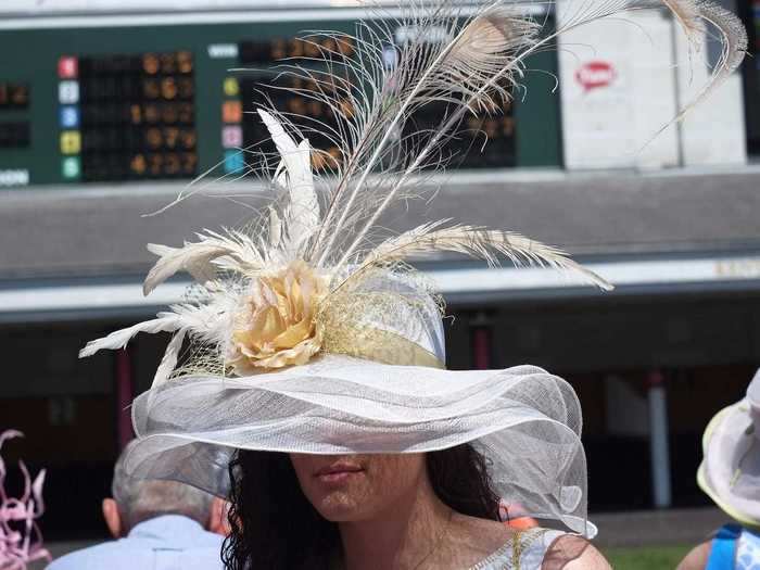 A woman at the 2015 race wore a sheer white hat that covered most of her face.