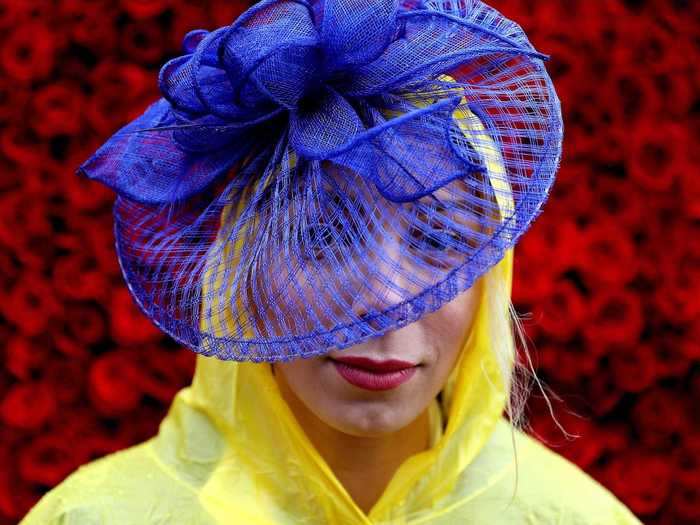 Not even a hooded raincoat could hinder this devoted Kentucky Derby fan from sporting a fabulous hat at the 2017 event.