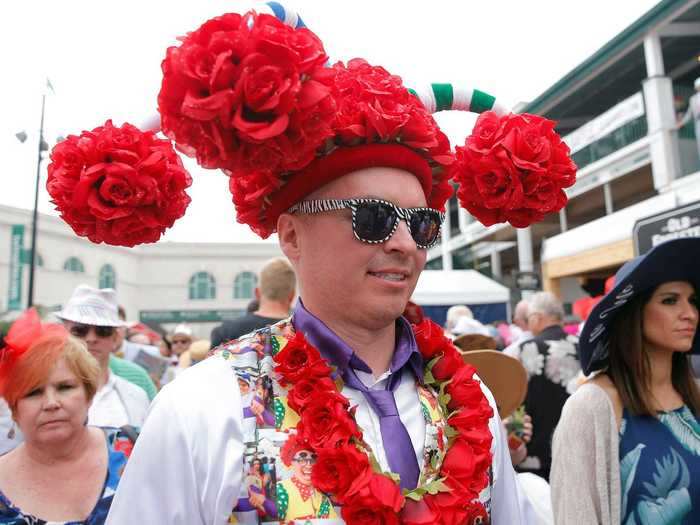 In 2019, this attendee wore a rose hat with multiple components.