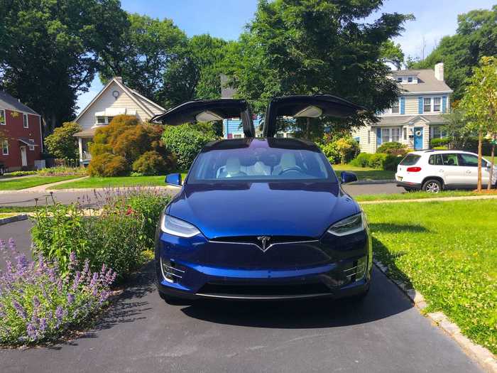 The most futuristic Tesla is the Model X SUV, with its exotic, upswinging, falcon-wing doors.