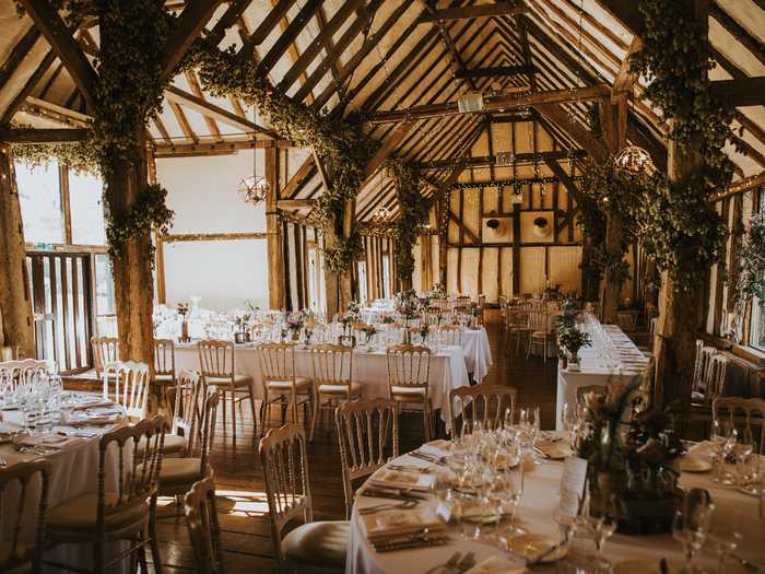 This English barn is decorated in classic greenery, emphasizing the natural, simple beauty of the space.