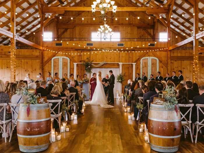 This barn features romantic bistro lights, wooden beams, and gorgeous natural lighting.