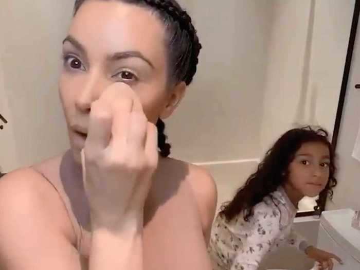 Kim Kardashian West said she was hiding from her four children in the guest bathroom.