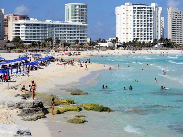 Five days later, on March 23, popular tourist destinations were still busy, like this beach in Cancun.