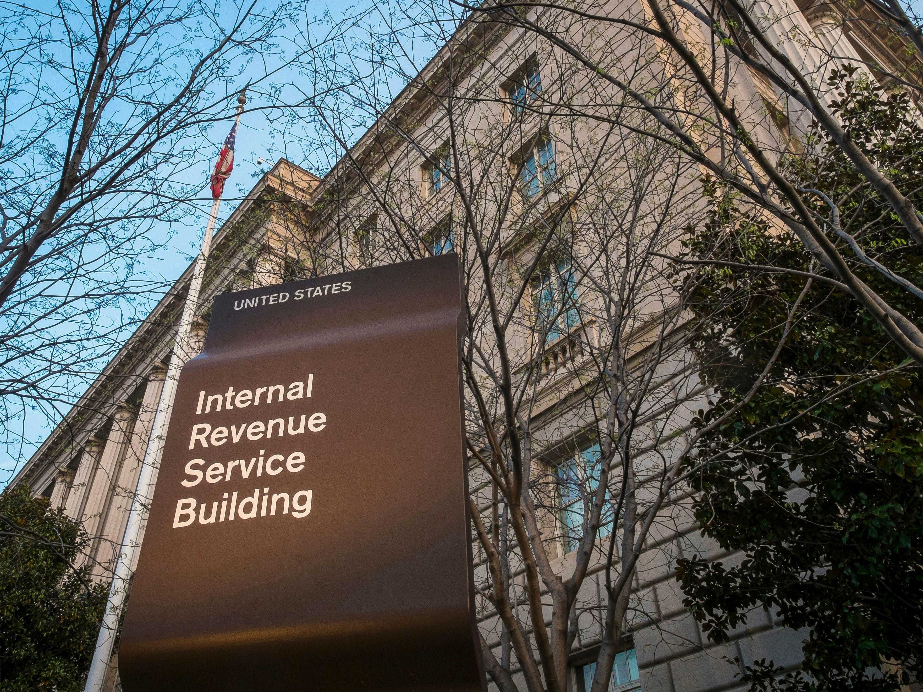 FILE - This April 13, 2014, file photo shows the Internal Revenue Service (IRS) headquarters building in Washington. 2019 was another tough year for the IRS, according to a new federal report. Burdened with years of budget cuts and a recent increase in workload to implement a new tax law, the IRS struggled to deliver on its mission in the past fiscal year. The annual report from the Office of Taxpayer Advocate found that in the 2019 fiscal year, among other problems, the agency failed to collect billions in unpaid taxes. (AP Photo/J. David Ake, File)