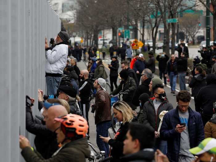 Throngs of New Yorkers broke stay-at-home orders to watch the massive former tanker come into port.