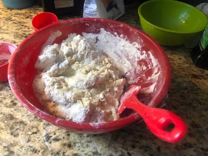 After letting that bowl sit for a few minutes, we mixed the liquid with some flour, salt, and olive oil.