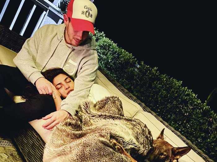 Nick Jonas and Priyanka Chopra Jonas snuggled with their dog.