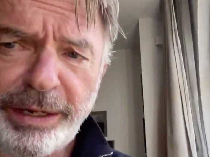 Sam Neill cleaned his shoes while spending time at home.