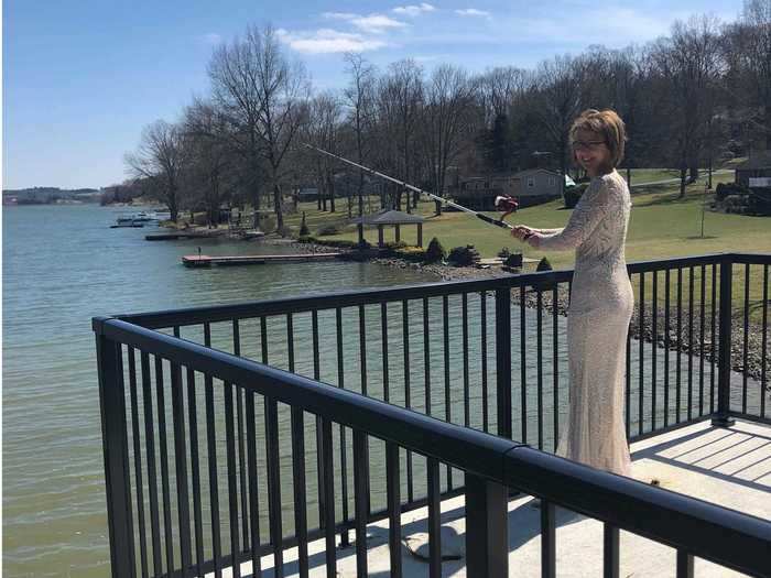 Emge posed by the lake on her property.