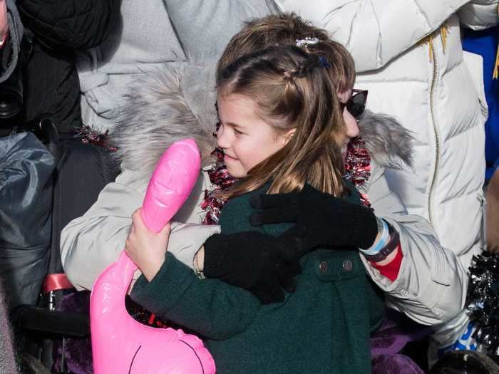 Here she is, hugging a fan who gifted her an inflatable pink flamingo.