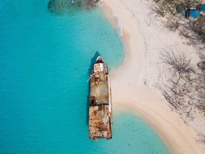 The Mega One Triton, a former oil rig, washed ashore on Governor