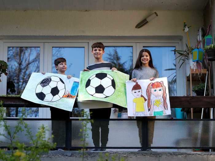 Other children have drawn soccer balls to show that they miss playing sports. "I drew a soccer ball, because we can