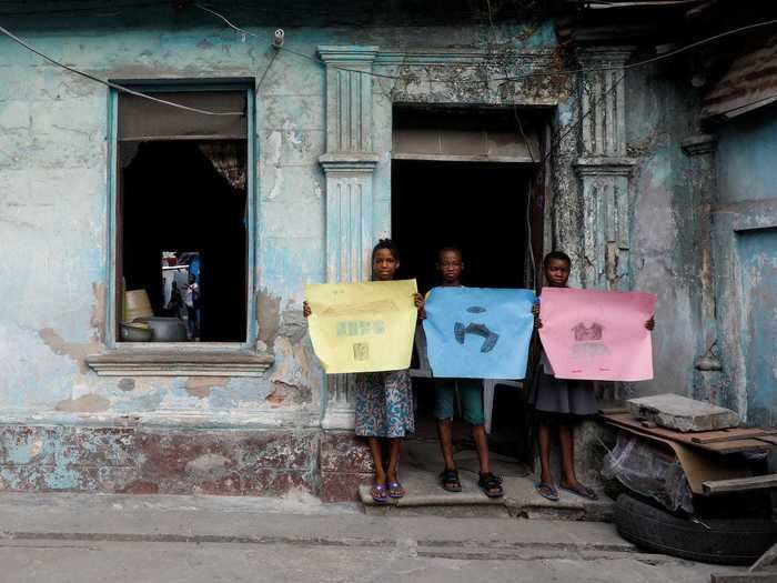 And in Nigeria, thousands of miles away, 11-year-old Olatunji Adebayo (seen here in the center) told Reuters, "I miss playing football with my friends before the lockdown ... I feel sad about the lockdown."