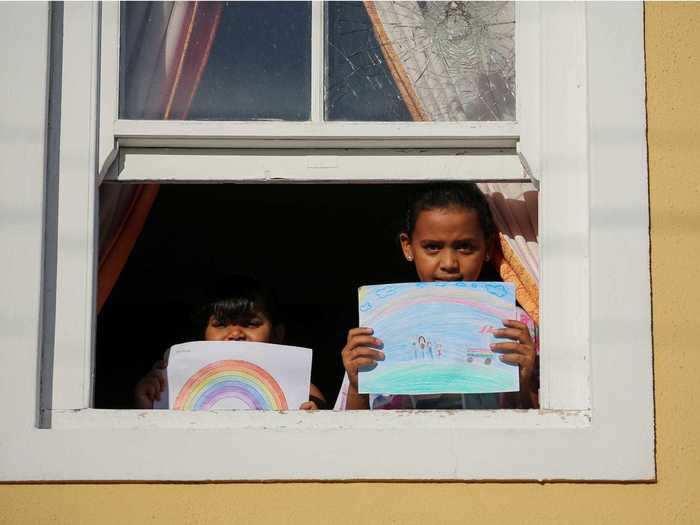 And in South Africa, two children held up drawings of rainbows, which has become a  symbol of hope among children under lockdown, and a nod to healthcare workers.