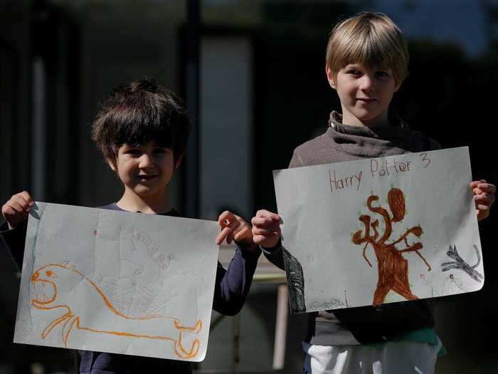 Other children simply used their drawings to show off their imagination. In France, these two boys held up images inspired by Harry Potter and fictional creatures.