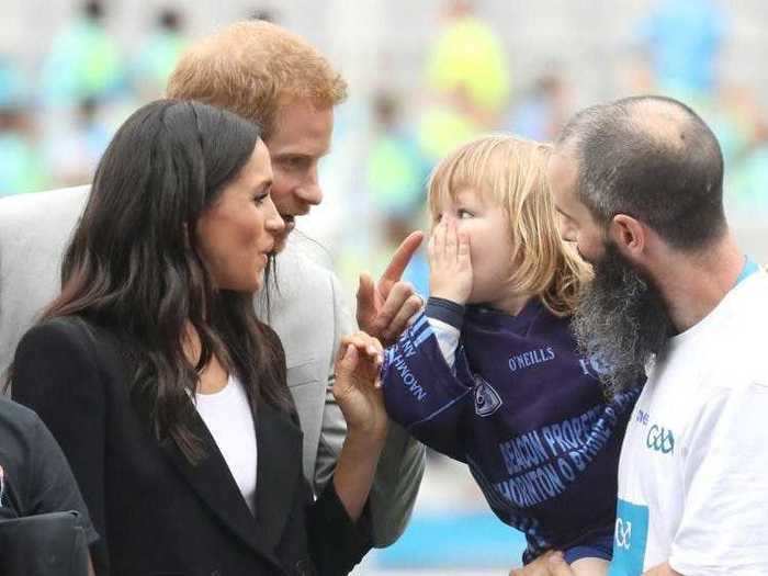 Harry playfully wagged his finger at a 3-year-old child who pulled Markle