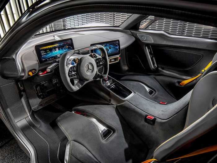 The interior is super minimalist and completely driver-focused, taking cues from an F1 cockpit.