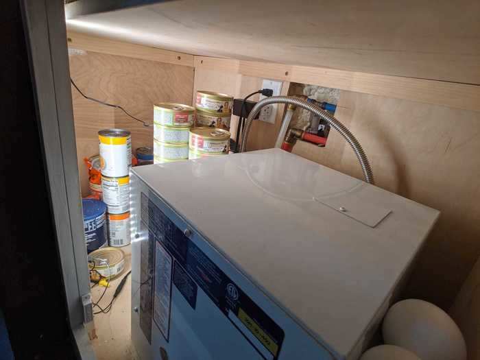 But not everything fits in the kitchen. They repurposed an extra storage space under the stairs, where they typically keep hurricane emergency stash stuff, to store canned food instead.